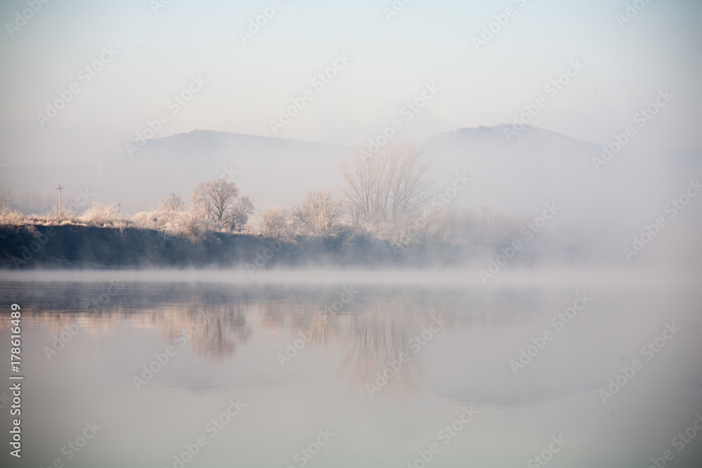 Morning on the river early morning reeds mist fog and water surface on the river Morning on the river early morning reeds mist fog and water surface on the river