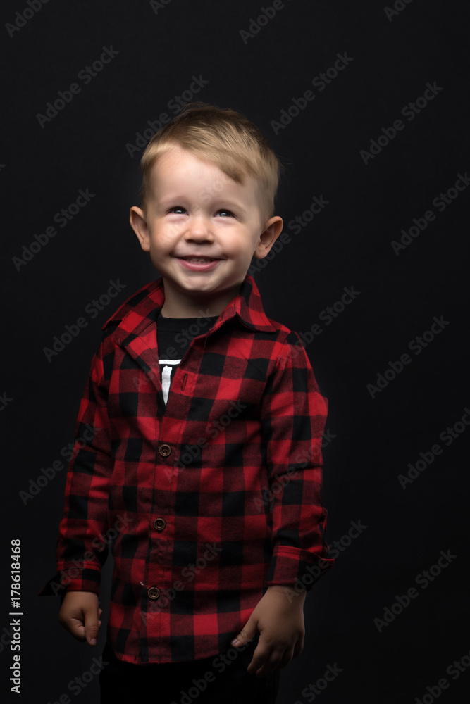 Little boy on a black background. Little boy on a black background.
