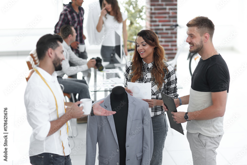 group of designers discuss men's suit group of designers discuss men's suit