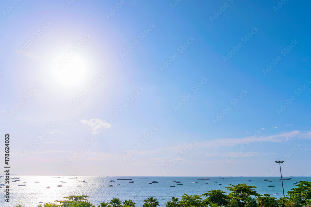 Scenic sea view with sunlight and boats