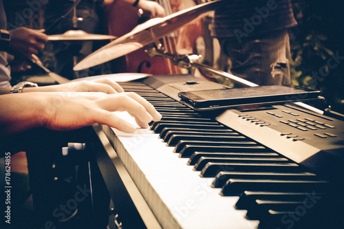 Hand on a piano.