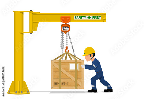 A worker is using the jib crane to handling the heavy wooden container on transparent background
