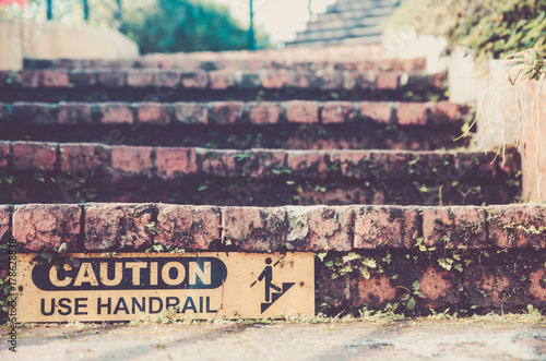 brick stair and caution sign to use handrail vintage   retro