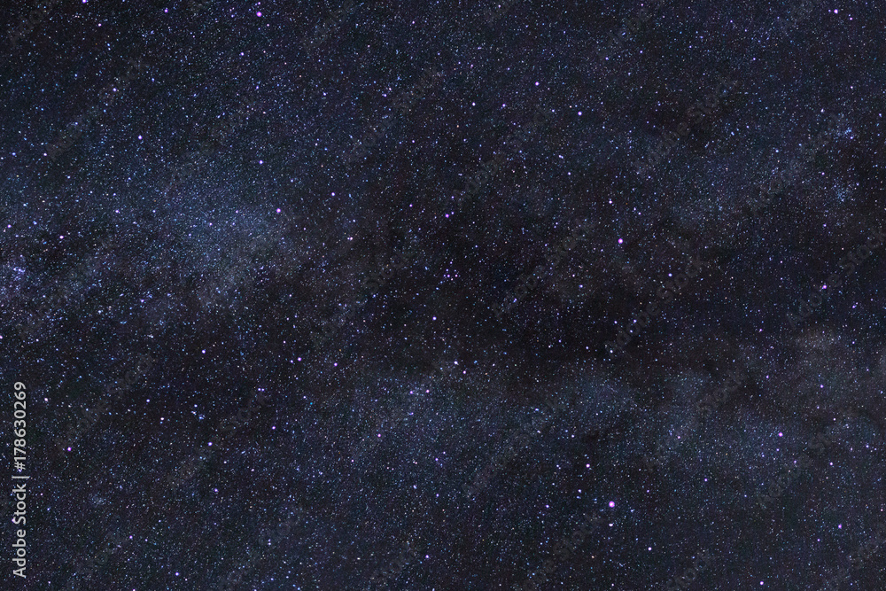 Starry night sky, Milky way galaxy with stars and space dust in the universe, Long exposure photograph, with grain. Starry night sky, Milky way galaxy with stars and space dust in the universe, Long exposure photograph, with grain.
