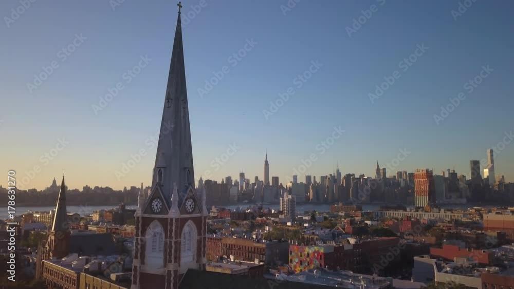 flying past Greenpoint Brooklyn church towards Manhattan skyline flying past Greenpoint Brooklyn church towards Manhattan skyline