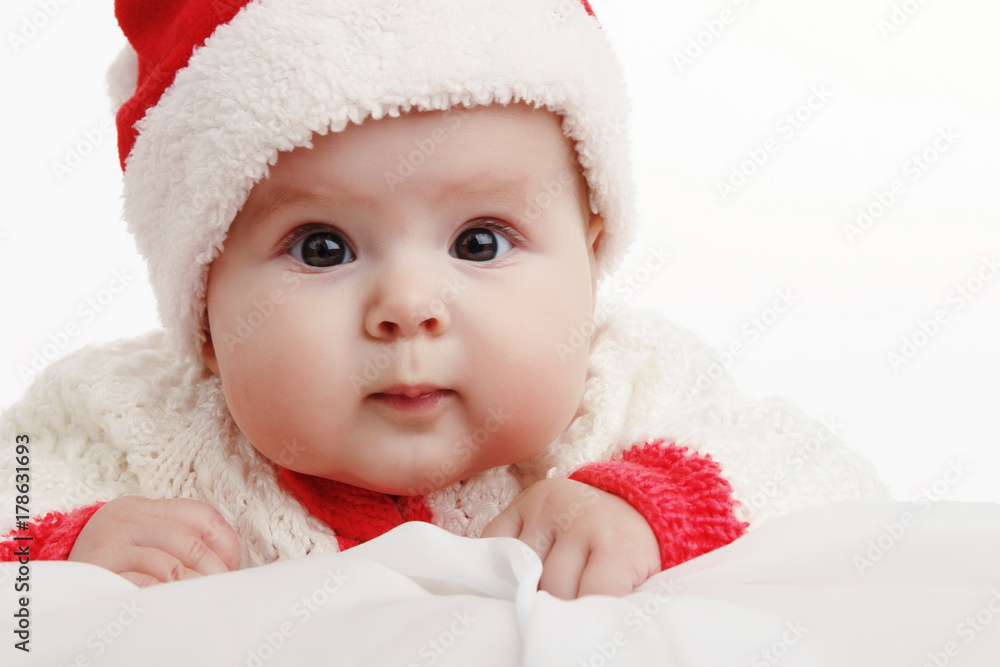 Beautiful girl in Christmas costume with Christmas balls toys. In Studio on white background isolated Beautiful girl in Christmas costume with Christmas balls toys. In Studio on white background isolated