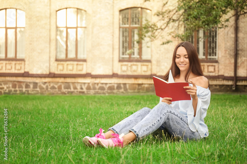 Young female student readin...