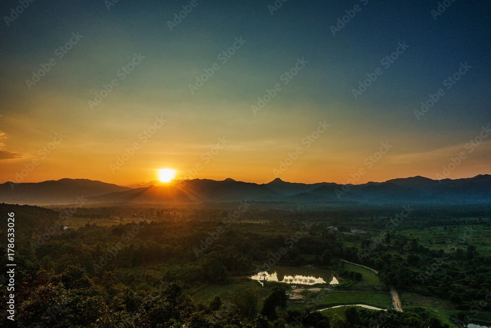 Sunset behind mountain in suburb Chiang mai, Thailand.