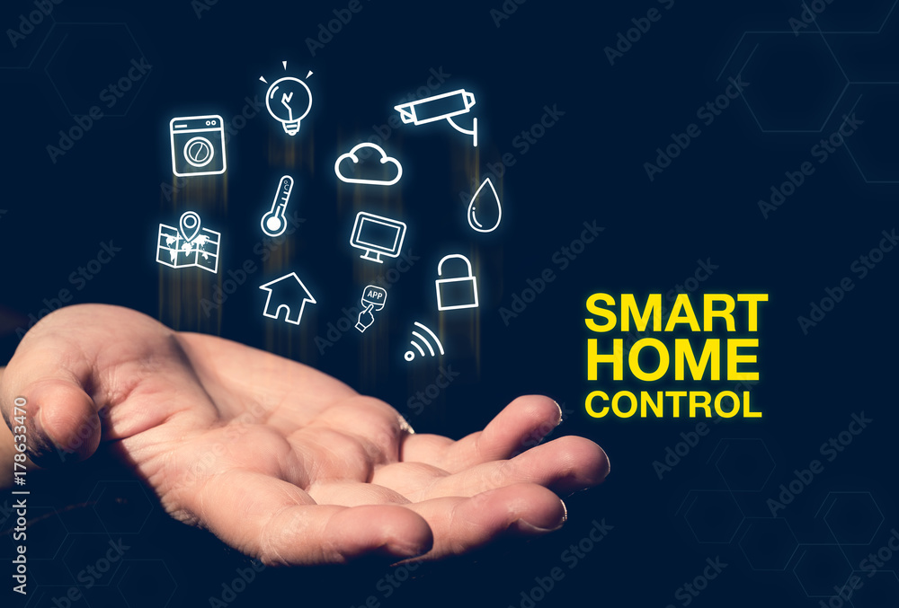 Smart home control word glowing icon floating over open hand on dark blue background,online payment,Digital marketing concept.