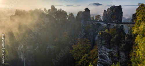 Fairytale  foggy sunrise over the Saxon Switzerland park in Germany