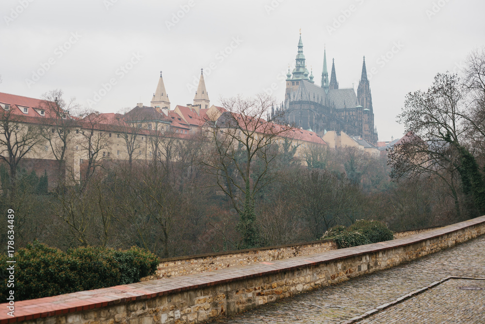Architecture of Prague. View of beautiful old buildings and cathedral in Prague's square in the winter time Architecture of Prague. View of beautiful old buildings and cathedral in Prague's square in the winter time