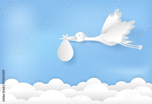 Paper art of stork flying with baby on blue sky