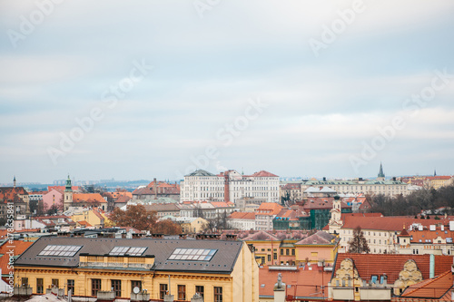 View from a high point. A beautiful view from above on the streets and roofs of houses in Prague. Traditional ancient urban architecture.