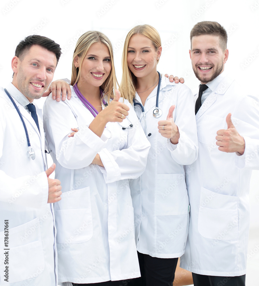 professional medical team showing thumb up