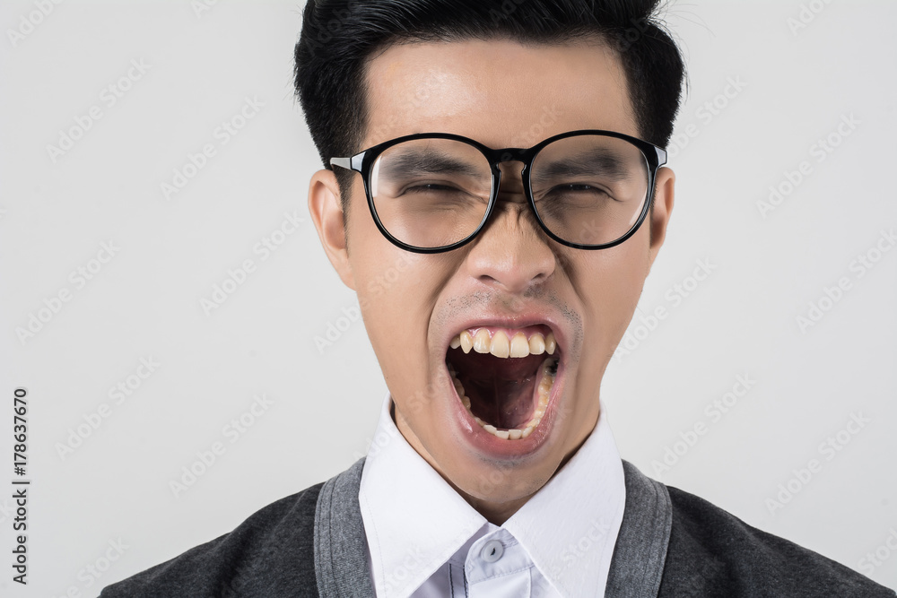Young nerd student isolated on white background. Young nerd student isolated on white background.