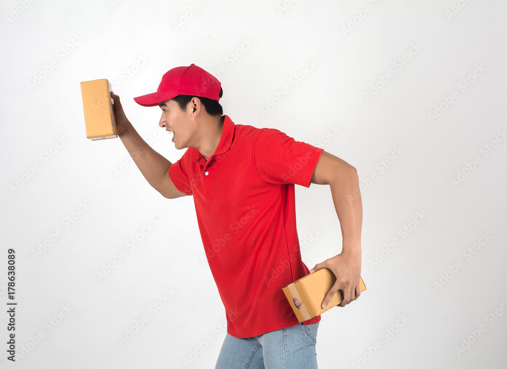 Handsome young delivery man with box isolated on white background. Handsome young delivery man with box isolated on white background.