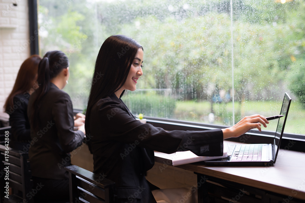 Young business woman have working on laptop in the office Young business woman have working on laptop in the office