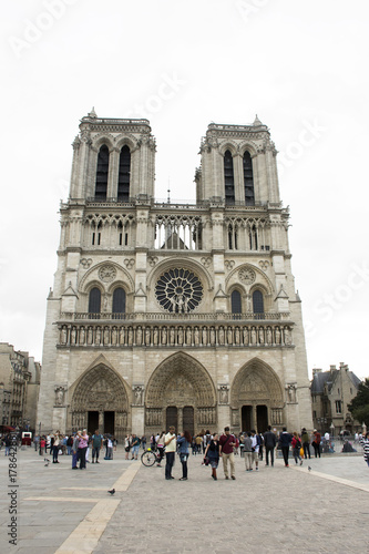 French people and foreigner travlers walking visit and take photo at courtyard of Cathedrale Notre-Dame de Paris