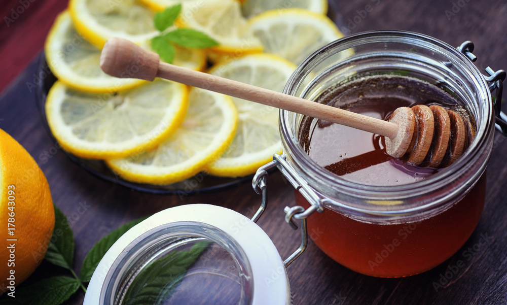Tea with lemon and mint in nature. A cup of hot mint tea with le Tea with lemon and mint in nature. A cup of hot mint tea with le