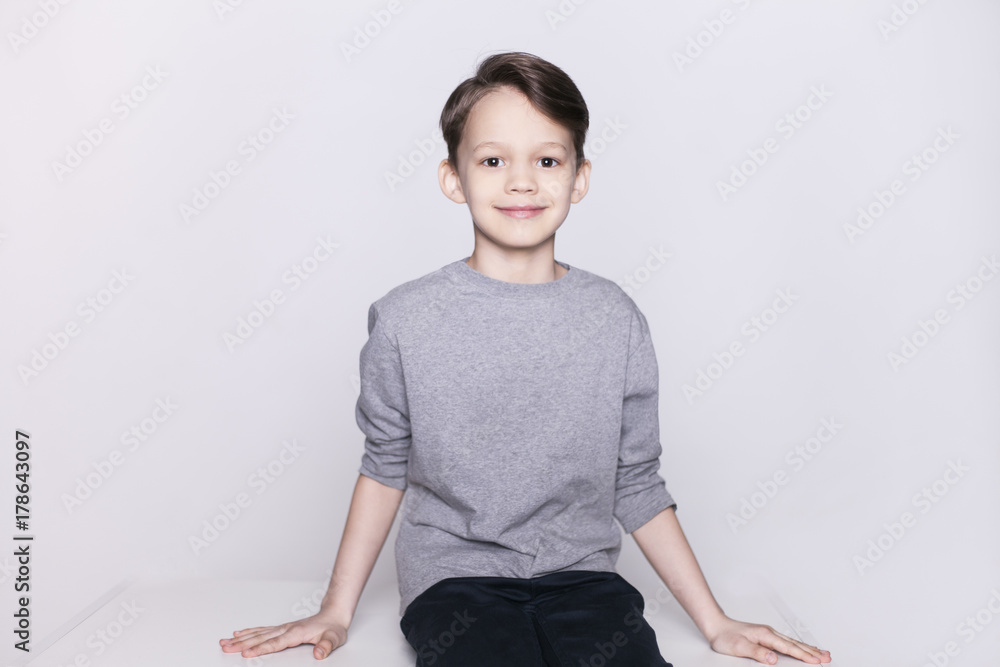Portrait of young happy brunette boy looking at camera isolated. Portrait of young happy brunette boy looking at camera isolated.