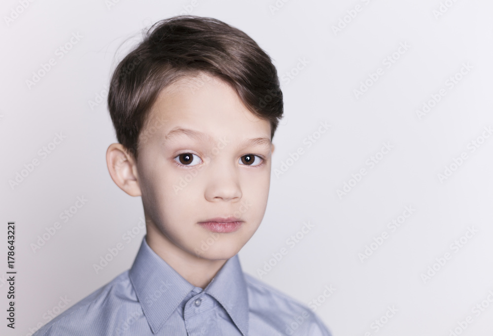 Portrait of young happy smiling brunette boy looking at camera isolated. Portrait of young happy smiling brunette boy looking at camera isolated.
