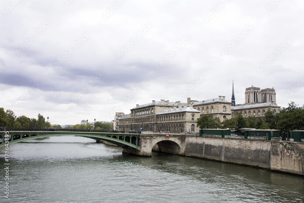 View landscape of Paris city at riverside of Seine river and and Hotel Dieu Hospital with top of Notre Dame Cathedral