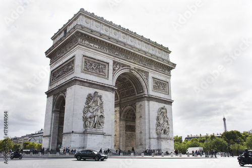 French people and foreigner travlers walk visit Arc de triomphe de l'Etoile or Triumphal Arch of the Star at Place Charles de Gaulle