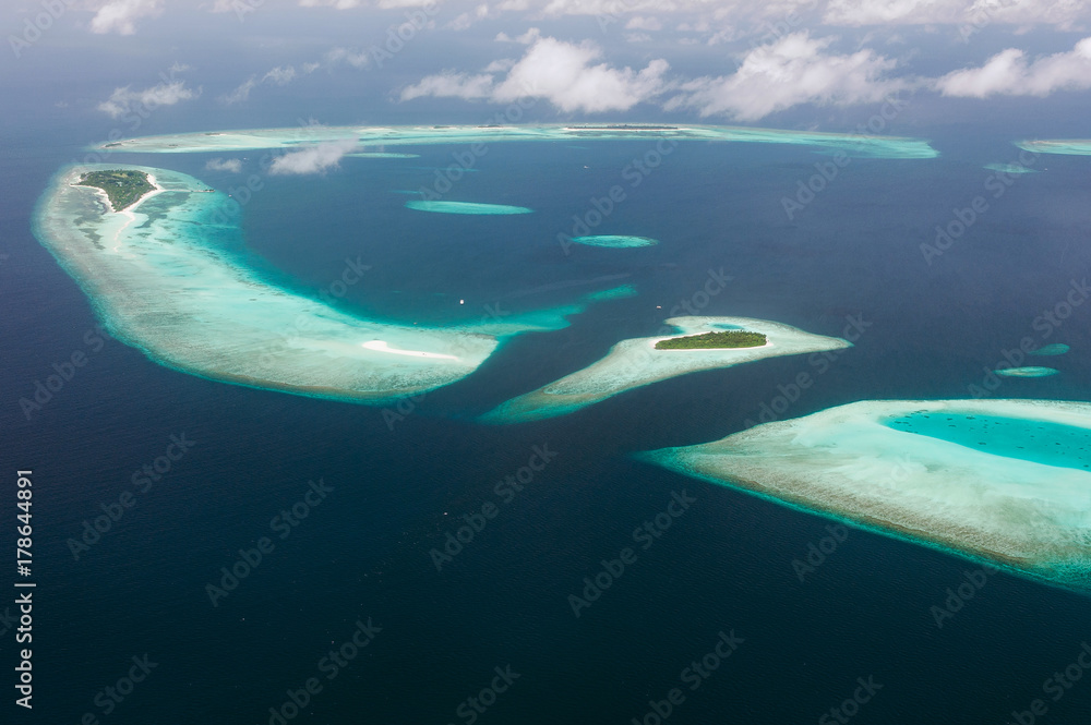 Tropical islands and atolls in Maldives in Indian Ocean from aerial view.  Piece of paradise on the Earth. Good choice for vacation. Beautiful top  view for wallpaper. Stock Photo | Adobe Stock