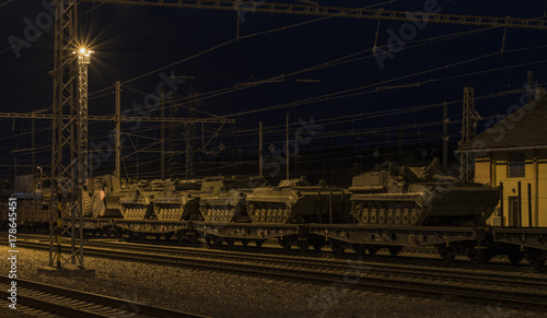 Train with army tanks in autumn night in Veseli nad Luznici