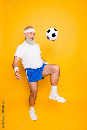 Fototapeta Naklejka Na Ścianę i Meble -  Full length of modern cool funny competetive pensioner, leader, champion. Funky, bodycare, healthcare, weight loss, strength, leadership, motivation, authority, gym lifestyle
