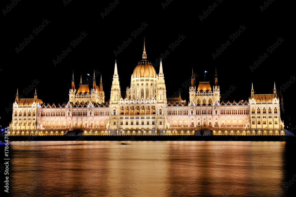 Budapest, Hungary - scenic view of the Parliament and Danube river at night