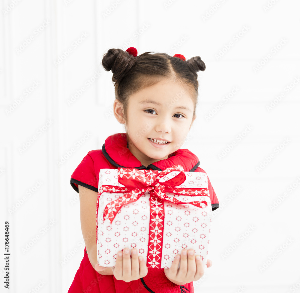 little girl showing gift for chinese new year. little girl showing gift for chinese new year.