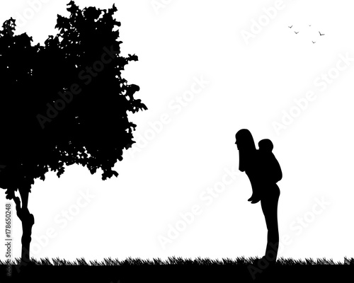 Mother carrying a child piggyback in park, one in the series of similar images silhouette