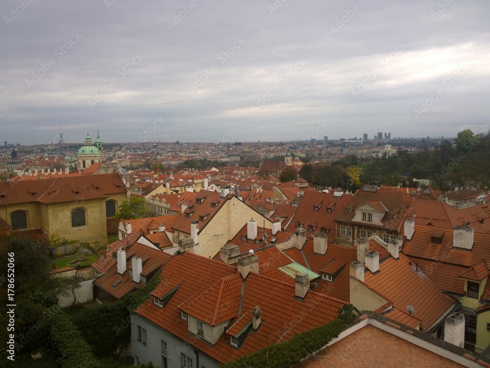 Fototapeta premium Panorama view of tile roofs in a historical part of Prague
