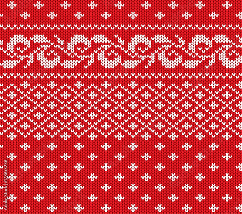 Knitted christmas red and white floral seamless ornament. Xmas knit winter sweater texture design.