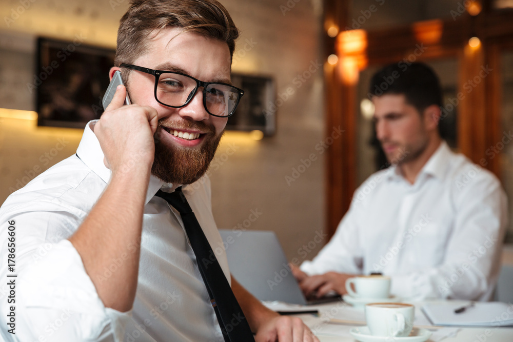 Fototapeta premium Portrait of a smiling bearded businessman