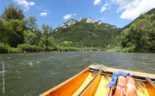 Rafting on the polish river on a Three Crowns background