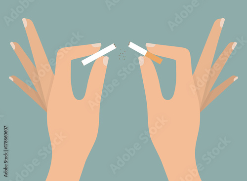 Woman's hands tearing apart cigarette. Quitting smoking concept