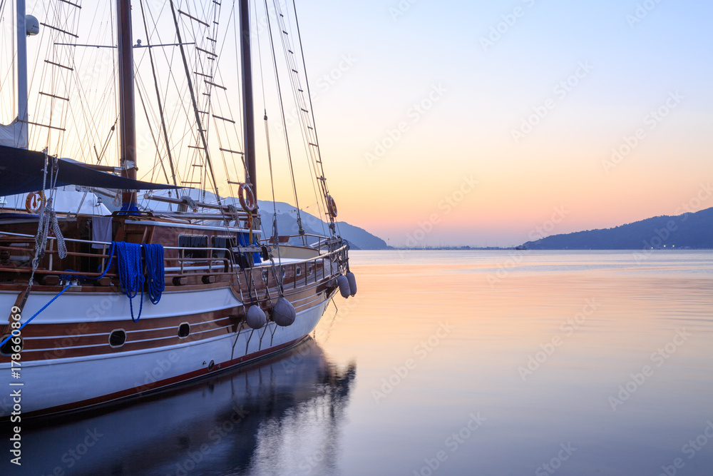 Single boat on Marmaris seaport during sunrise
