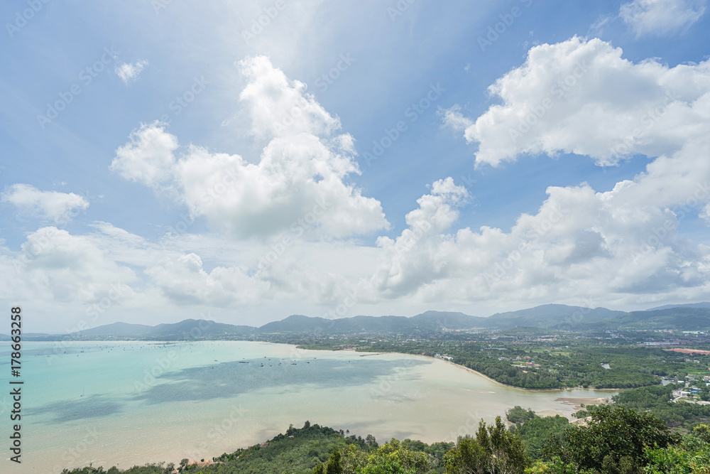 Sea, sky and seaside town of Ao Chalong bay from Khao-Khad mountain viewpoint. Famous attractions in Phuket island, Thailand