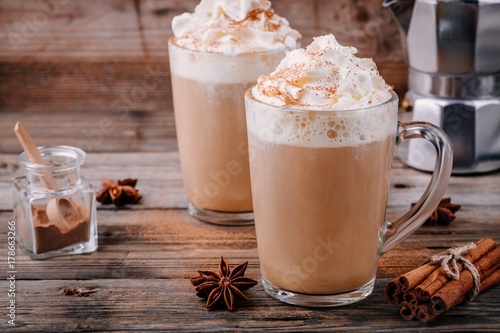 Fototapeta Pumpkin spice latte with whipped cream and cinnamon