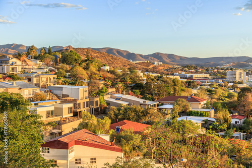 Windhoek rich resedential area quarters on the hills with CBD and mountains in the background, Windhoek, Namibia photo