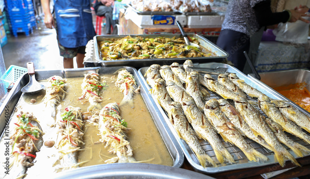 Fried salted fish and various Thai style food for sell at Nang Loeng market, Bangkok, Thailand