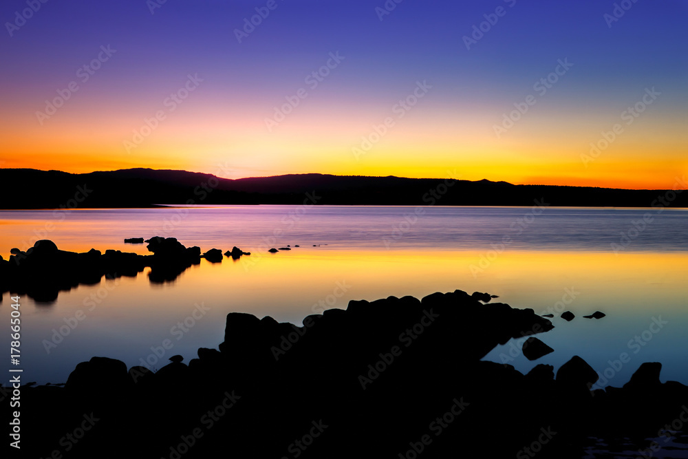 Fototapeta premium Beautiful sunset with golden and black colours