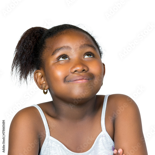 Cute african girl looking up isolated.