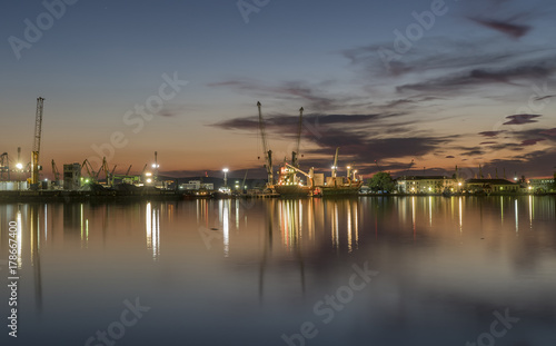 port on sunset with water reflections