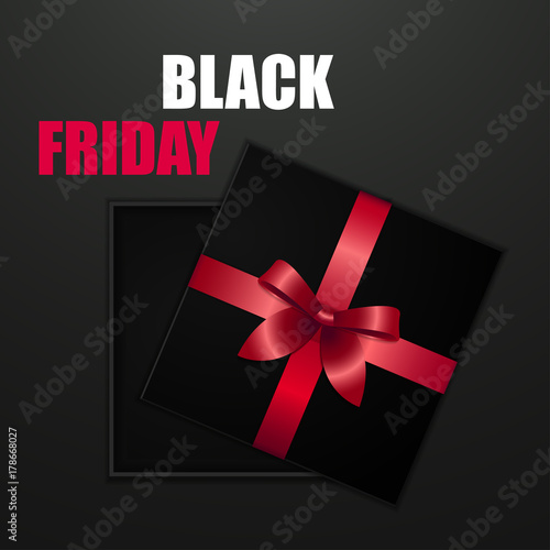 Black friday sale Black cardboard box tied with a red ribbon with a bow is lying on a black background with the inscription Black friday Top view Template for the poster, banner and web