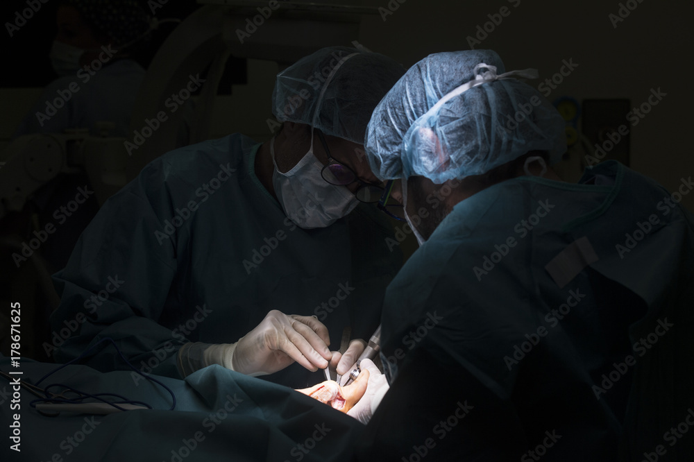 Surgeons doing a foot surgery. close up.