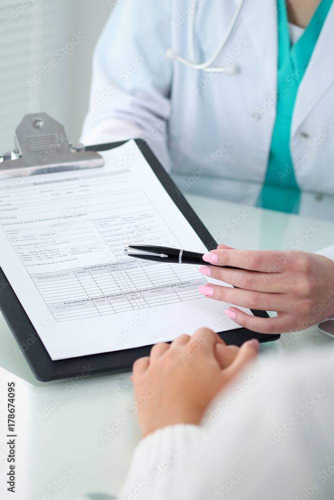 Doctor and patient, close-up of hands. Physician talking about medical examination results. Medicine, healthcare and helping concept Doctor and patient, close-up of hands. Physician talking about medical examination results. Medicine, healthcare and helping concept