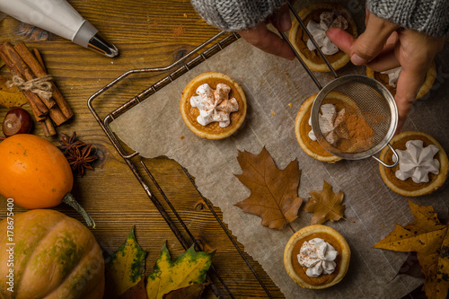 Thanksgiving concept - making mini pumpkin pies